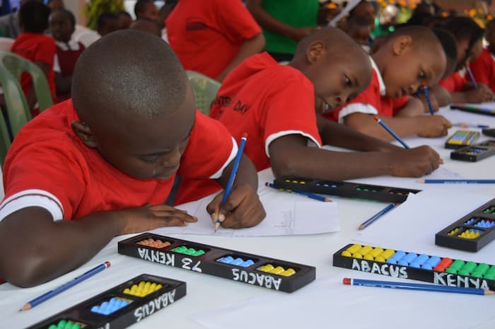 children working on abacus